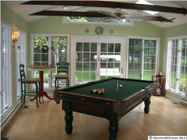 64 Beaver Dam Road Colts Neck, NJ 07722 - Photo 2 of 3 a bed sitting in a roof deck