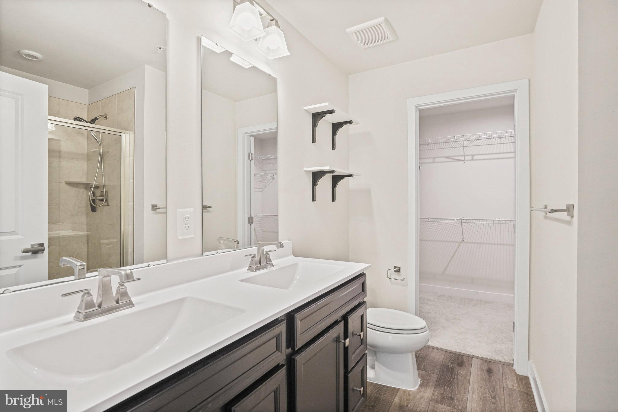 2808 Devonshire Cliffs Terrace Hyattsville, MD 20782 - Photo 9 of 19 a bathroom with a sink a toilet and shower