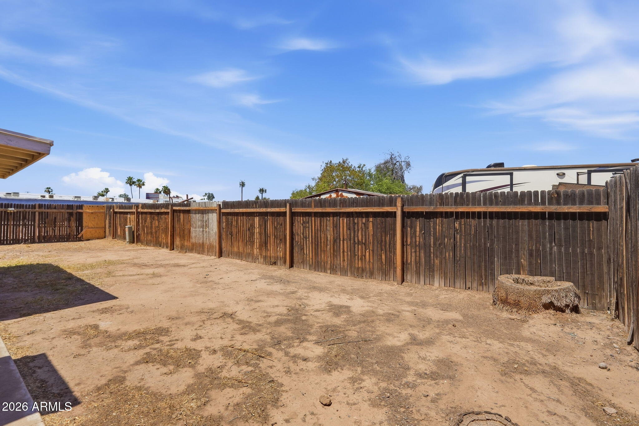 6452 West Thomas Road Phoenix, AZ 85033 - Photo 26 of 30 a backyard of a house with wooden fence