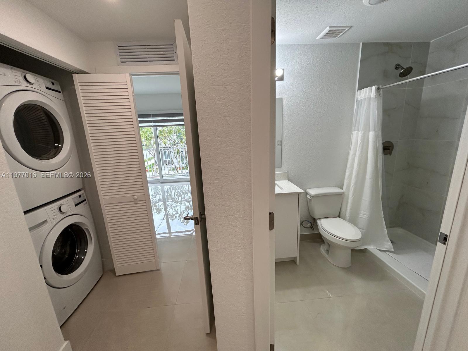 25814 Southwest 144th Court, Unit 2 Homestead, FL 33032 - Photo 12 of 25 a bathroom with a toilet and a sink