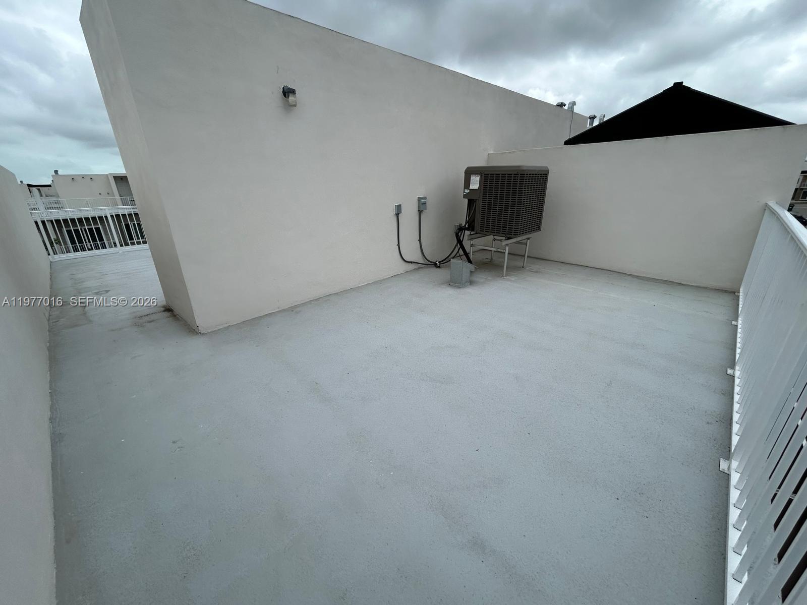 25814 Southwest 144th Court, Unit 2 Homestead, FL 33032 - Photo 23 of 25 a view of an empty room with a window