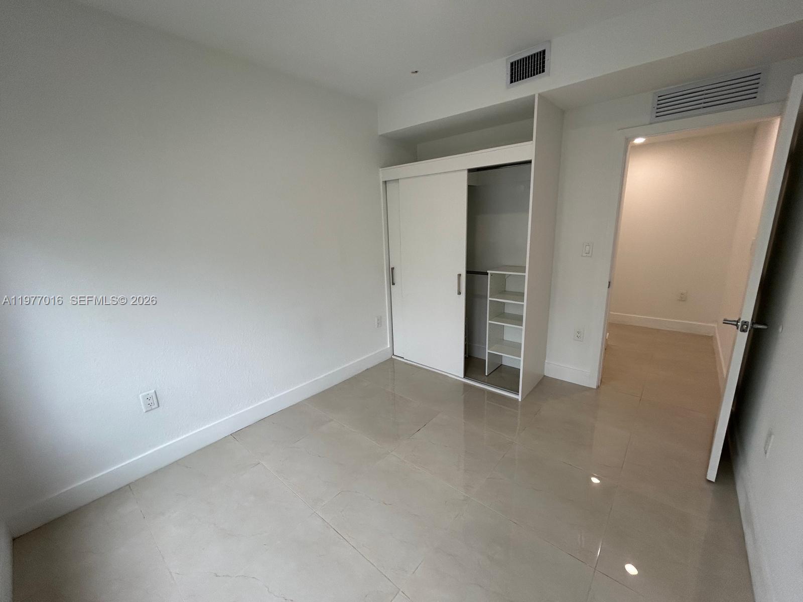 25814 Southwest 144th Court, Unit 2 Homestead, FL 33032 - Photo 9 of 25 a view of an empty room