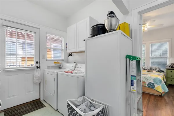 a view of utility room and bedroom