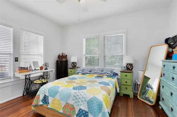 a bed room with a bed and a chair
