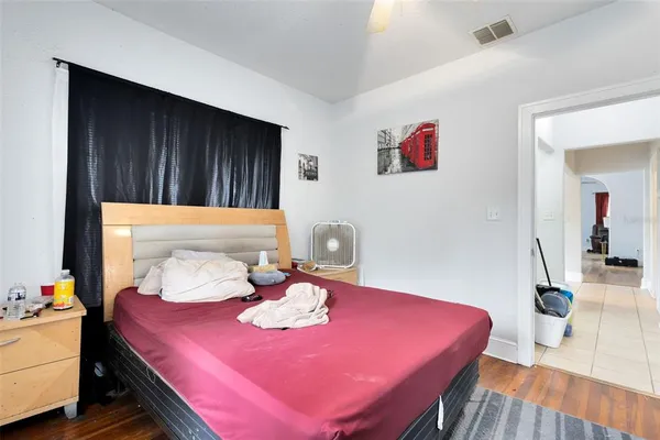 a bedroom with a bed and a table