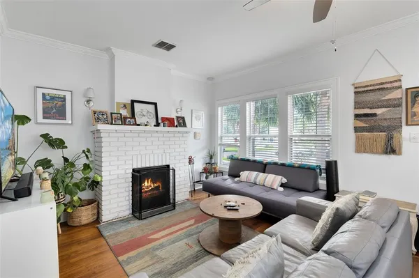 a living room with furniture and a fireplace