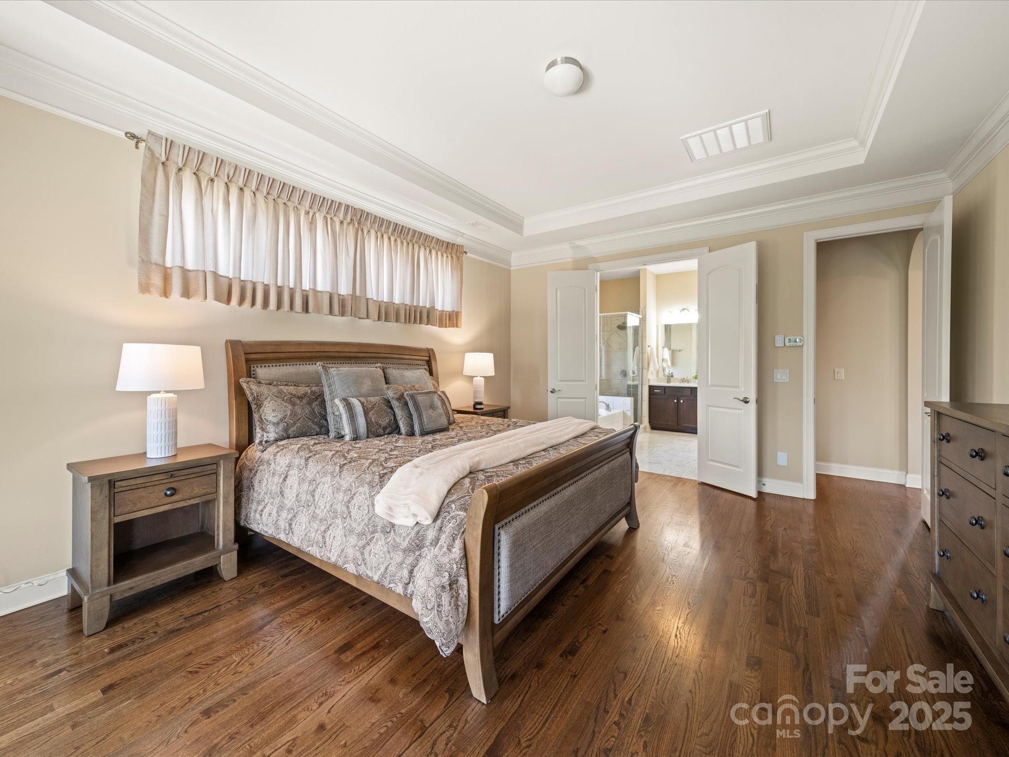 11632 Barnard Street Mint Hill, NC 28227 - Photo 14 of 39 a bedroom with a bed and a television