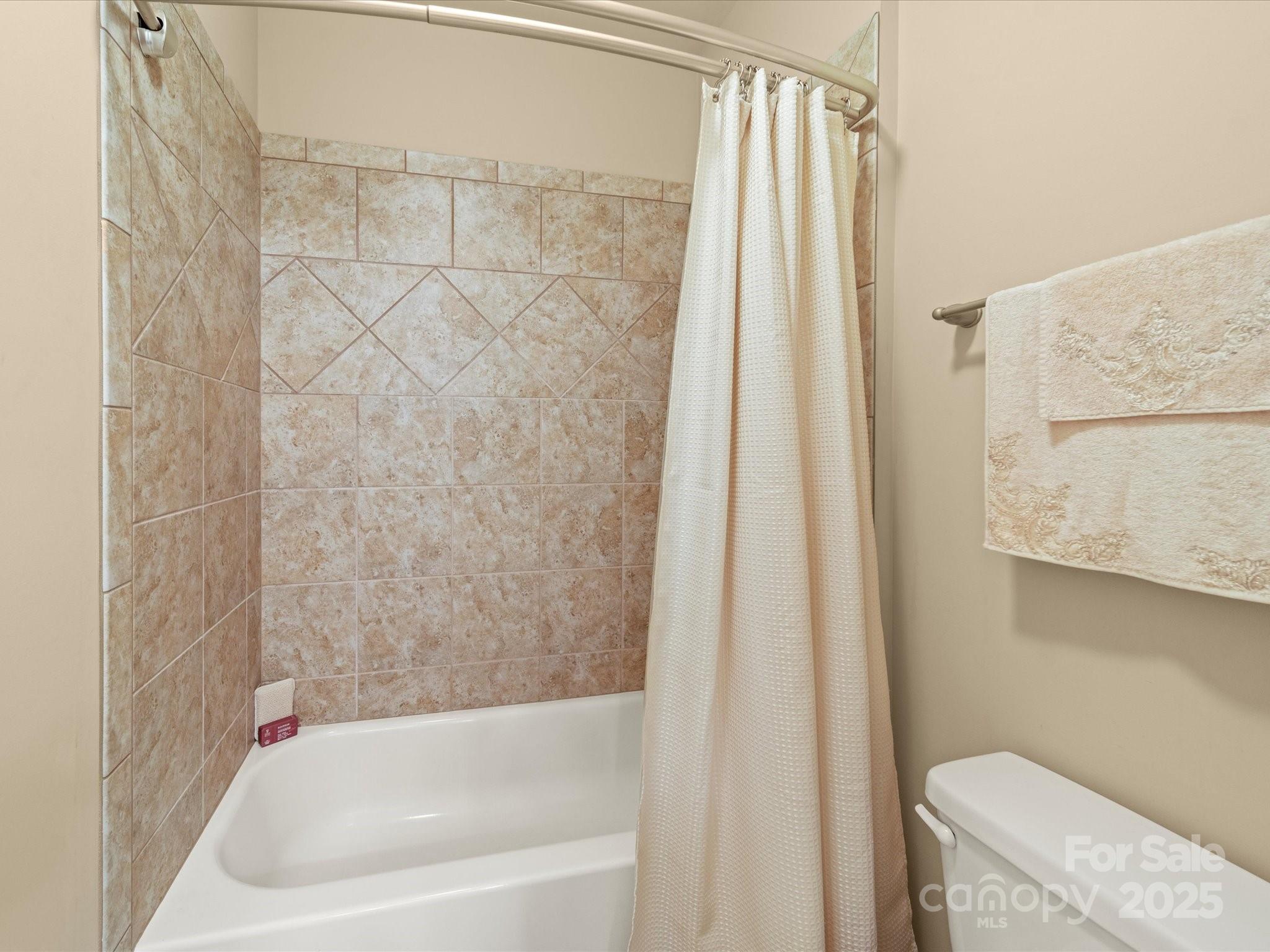 11632 Barnard Street Mint Hill, NC 28227 - Photo 20 of 39 a bathroom with a bathtub and a shower