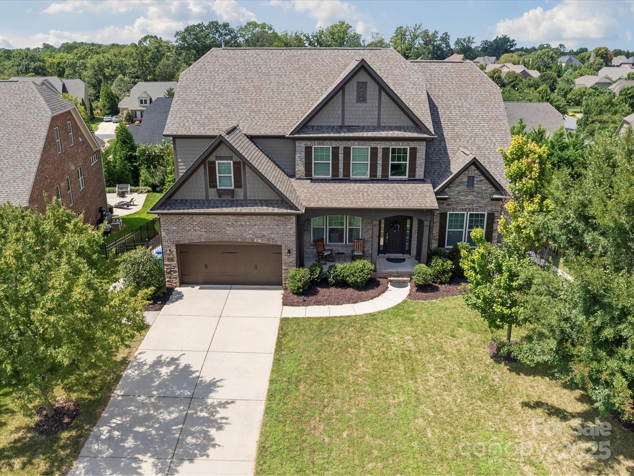 11632 Barnard Street Mint Hill, NC 28227 - Photo 2 of 39 a front view of a house with yard and green space