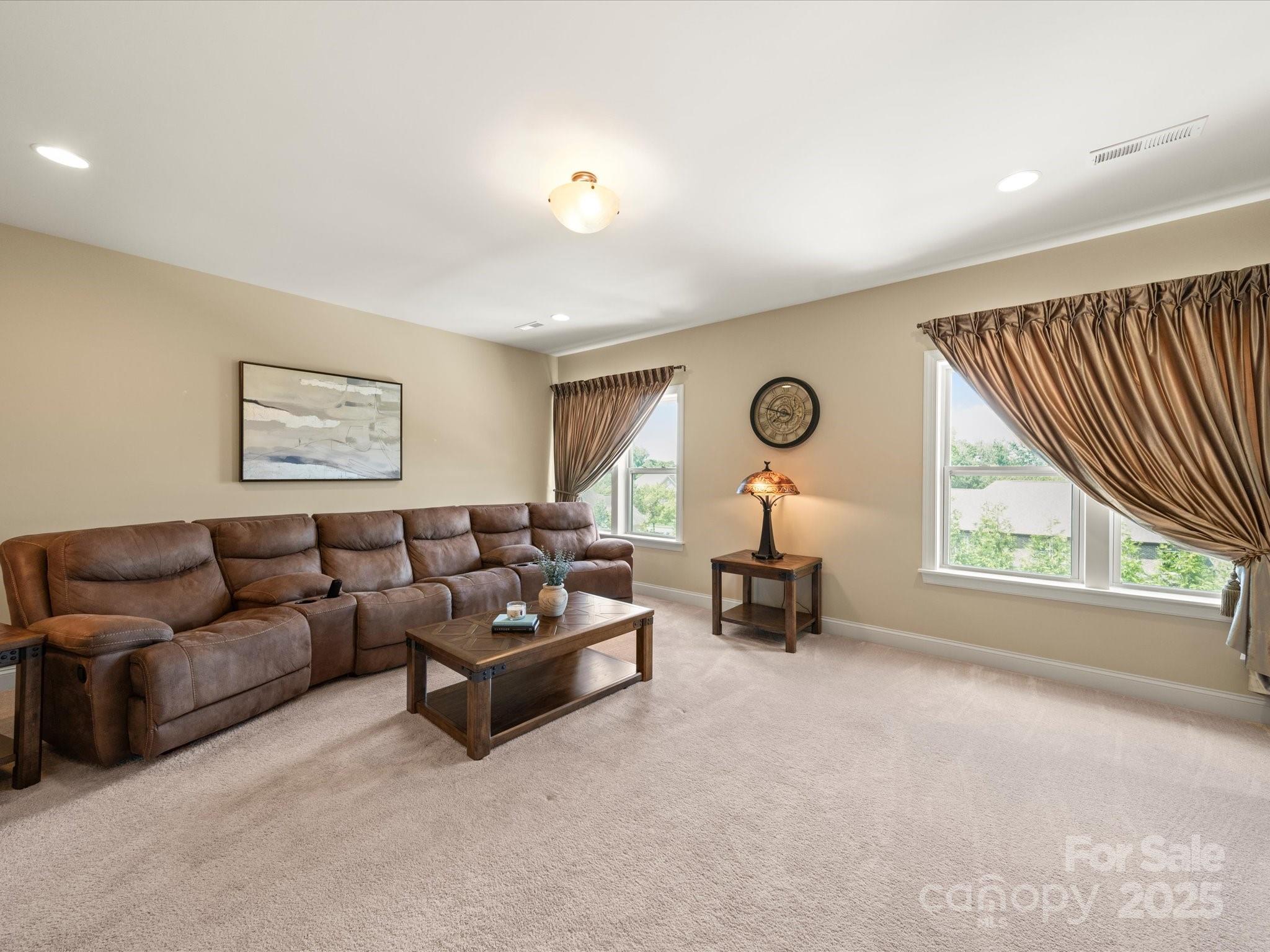 11632 Barnard Street Mint Hill, NC 28227 - Photo 22 of 39 a living room with furniture and a large window
