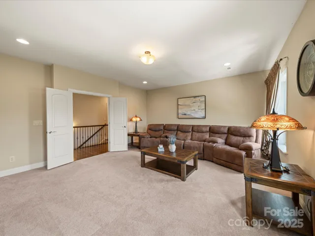 a spacious bedroom with a bed and a window