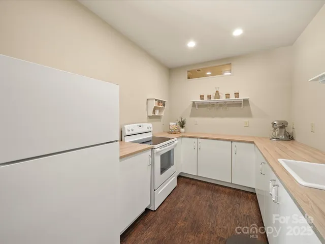 a spacious bathroom with a sink and a mirror