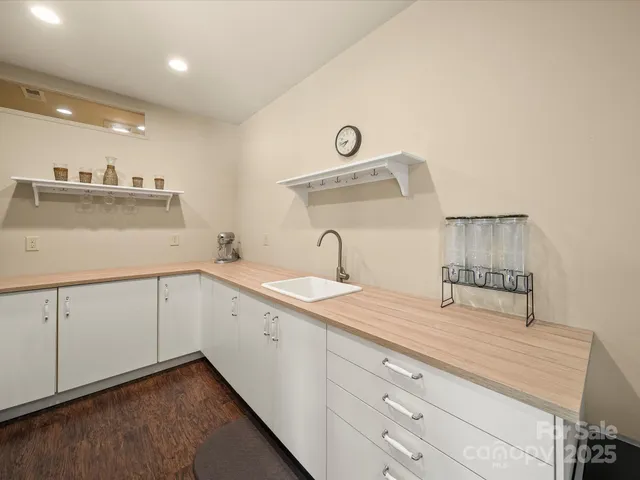 a living room with furniture and a lamp