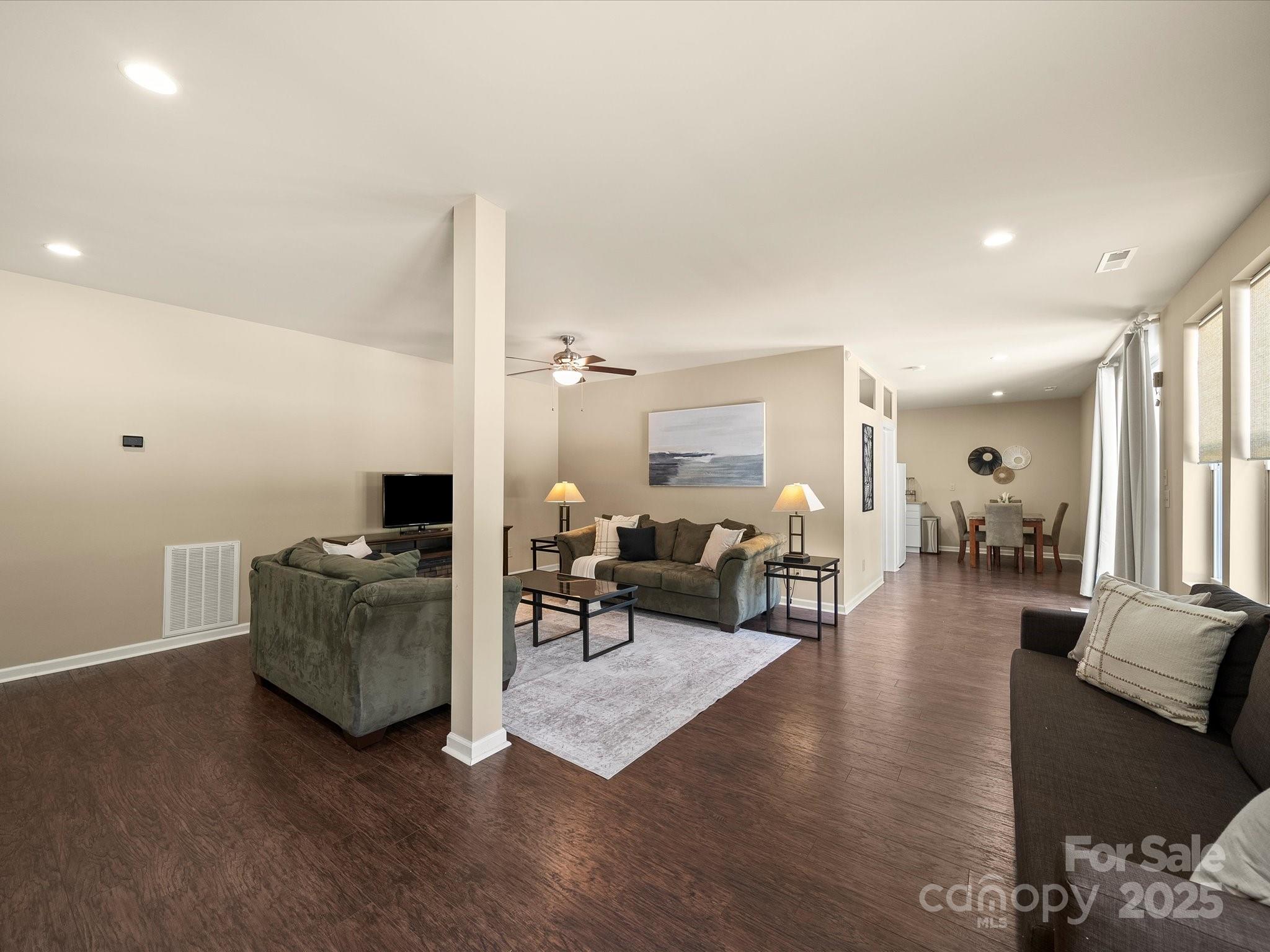 11632 Barnard Street Mint Hill, NC 28227 - Photo 31 of 39 a living room with furniture and wooden floor