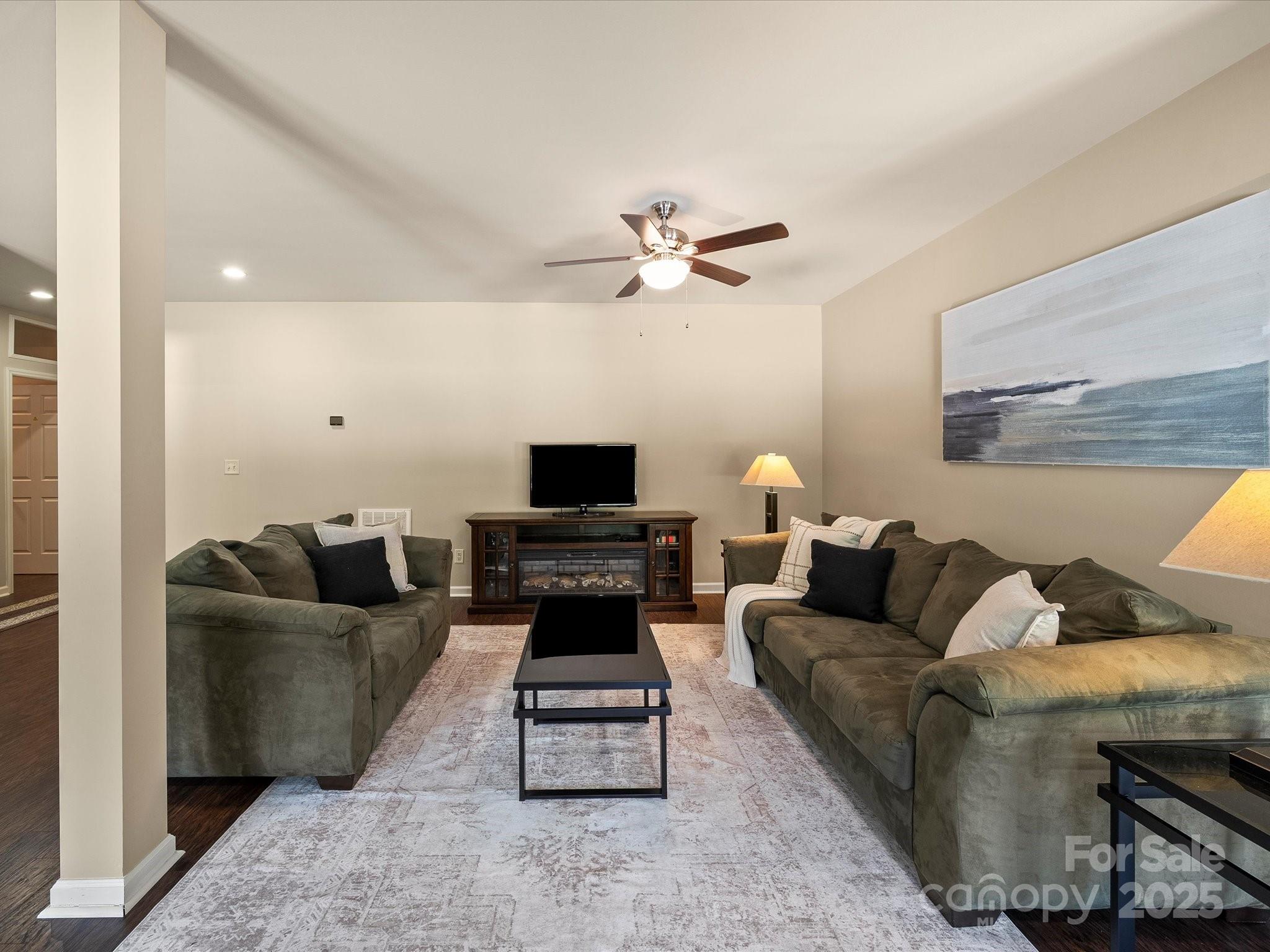 11632 Barnard Street Mint Hill, NC 28227 - Photo 36 of 39 a living room with furniture and a flat screen tv
