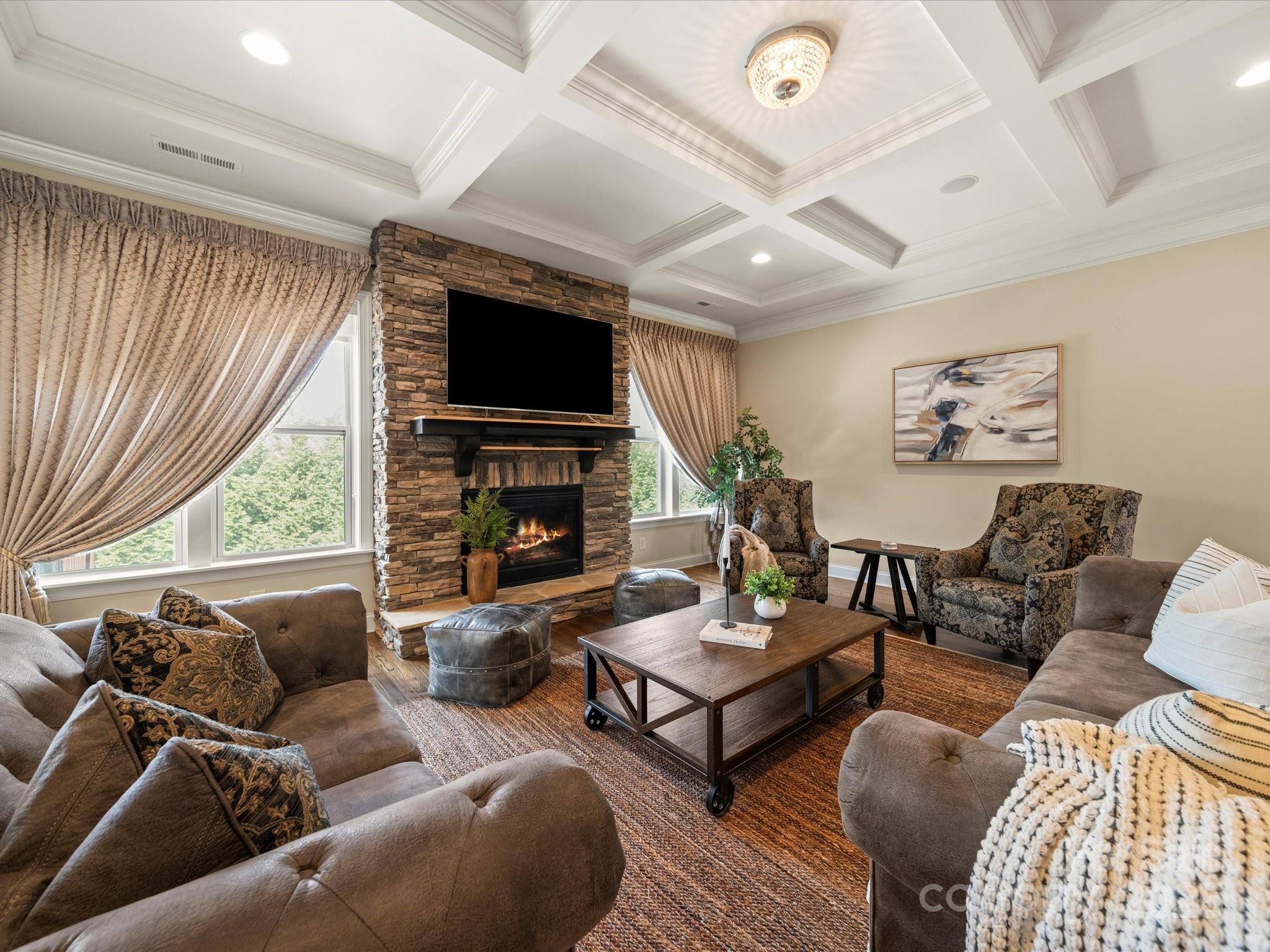 11632 Barnard Street Mint Hill, NC 28227 - Photo 7 of 39 a living room with furniture a fireplace and a flat screen tv