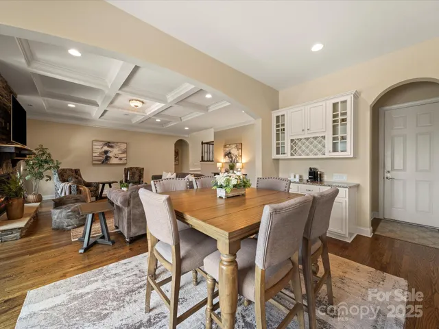 a kitchen with granite countertop a sink a counter space appliances and cabinets