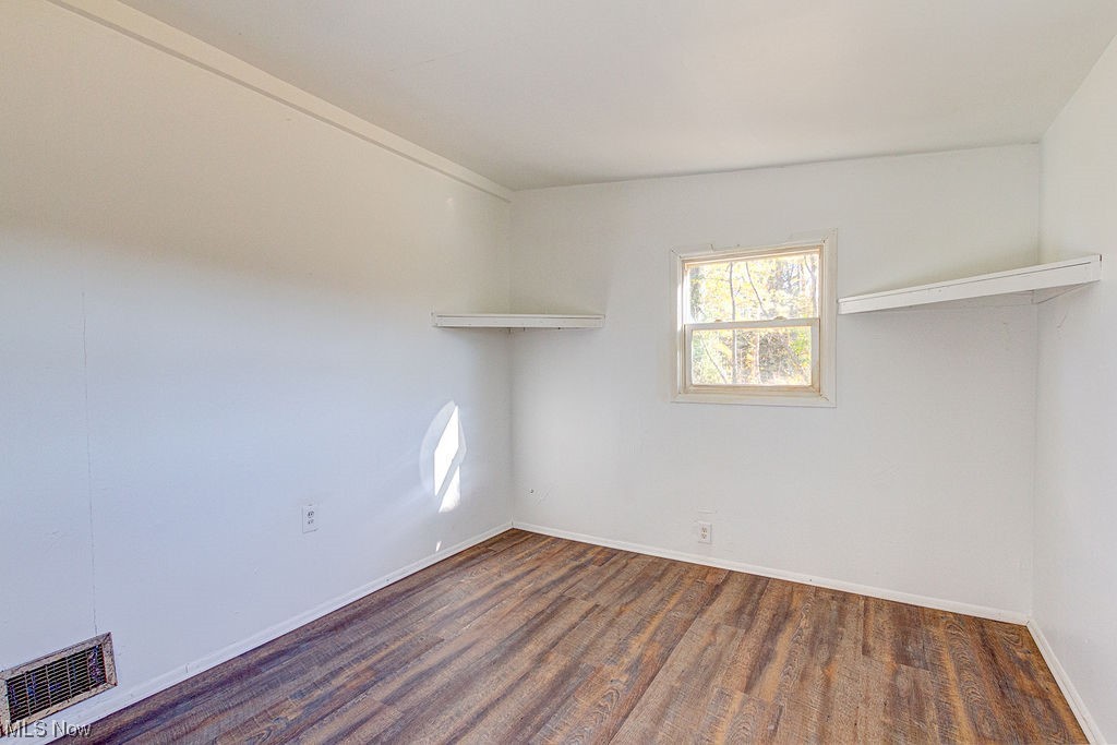 4728 Davis Road Perry, OH 44081 - Photo 6 of 18 Spare room with dark hardwood / wood-style flooring