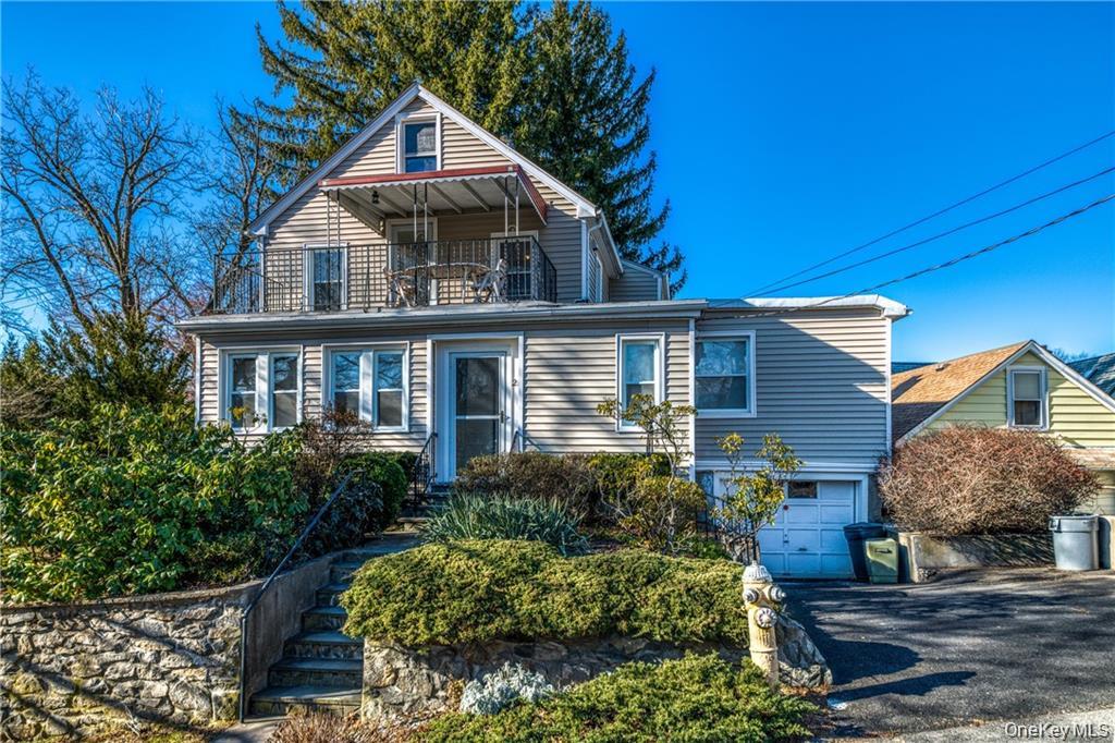 21 Wallace Street, Unit 2 Tuckahoe, NY 10707 - Photo 1 of 19 a view of a house with wooden fence and plants