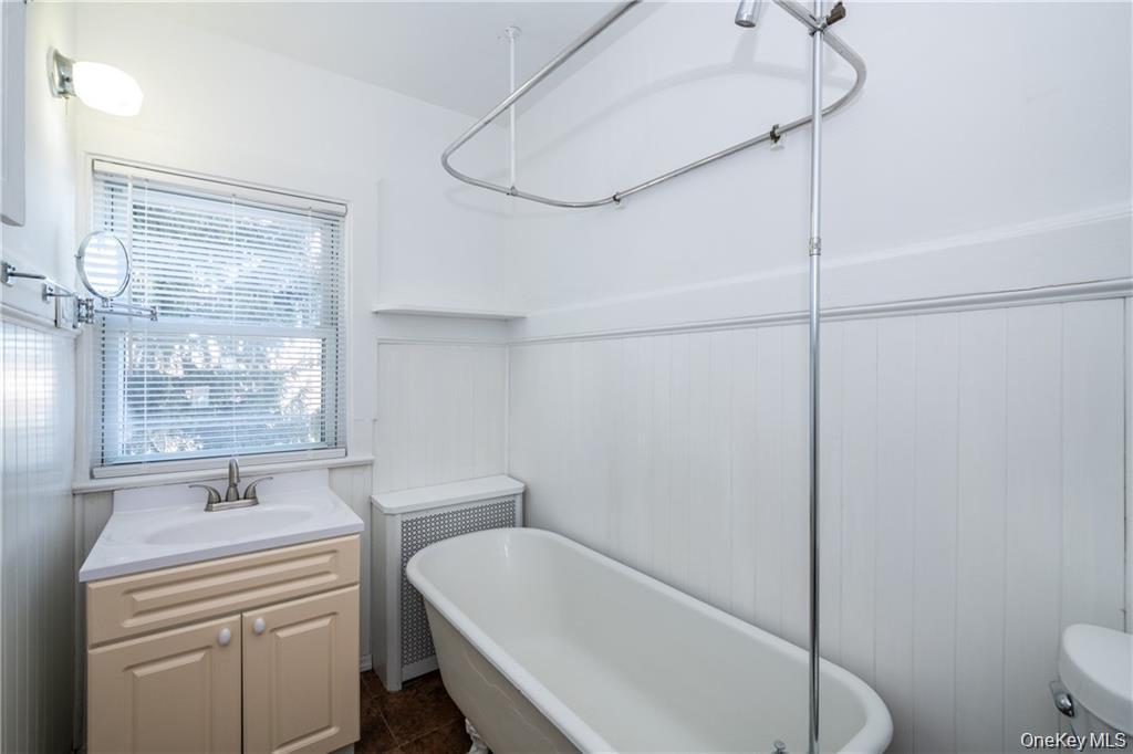21 Wallace Street, Unit 2 Tuckahoe, NY 10707 - Photo 15 of 19 a bathroom with a sink a toilet and shower