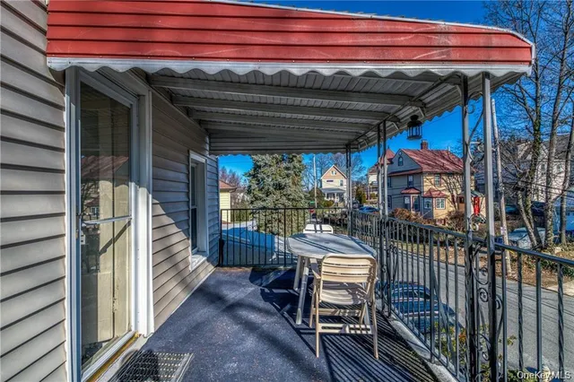 a view of a patio with table and chairs