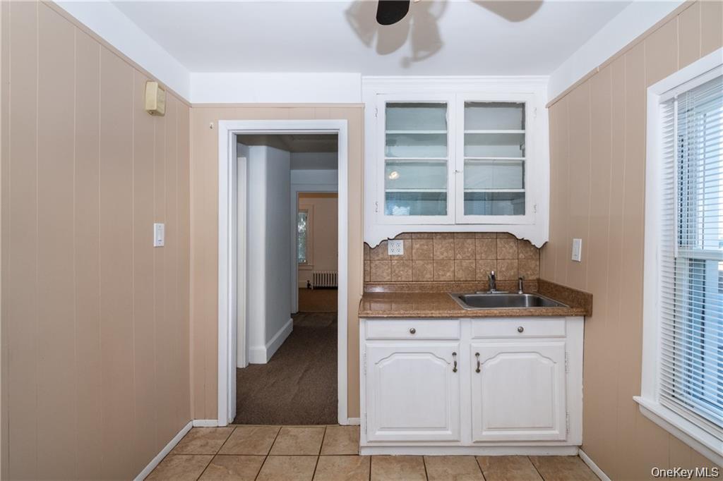21 Wallace Street, Unit 2 Tuckahoe, NY 10707 - Photo 9 of 19 a view of cabinets with wooden floor and windows