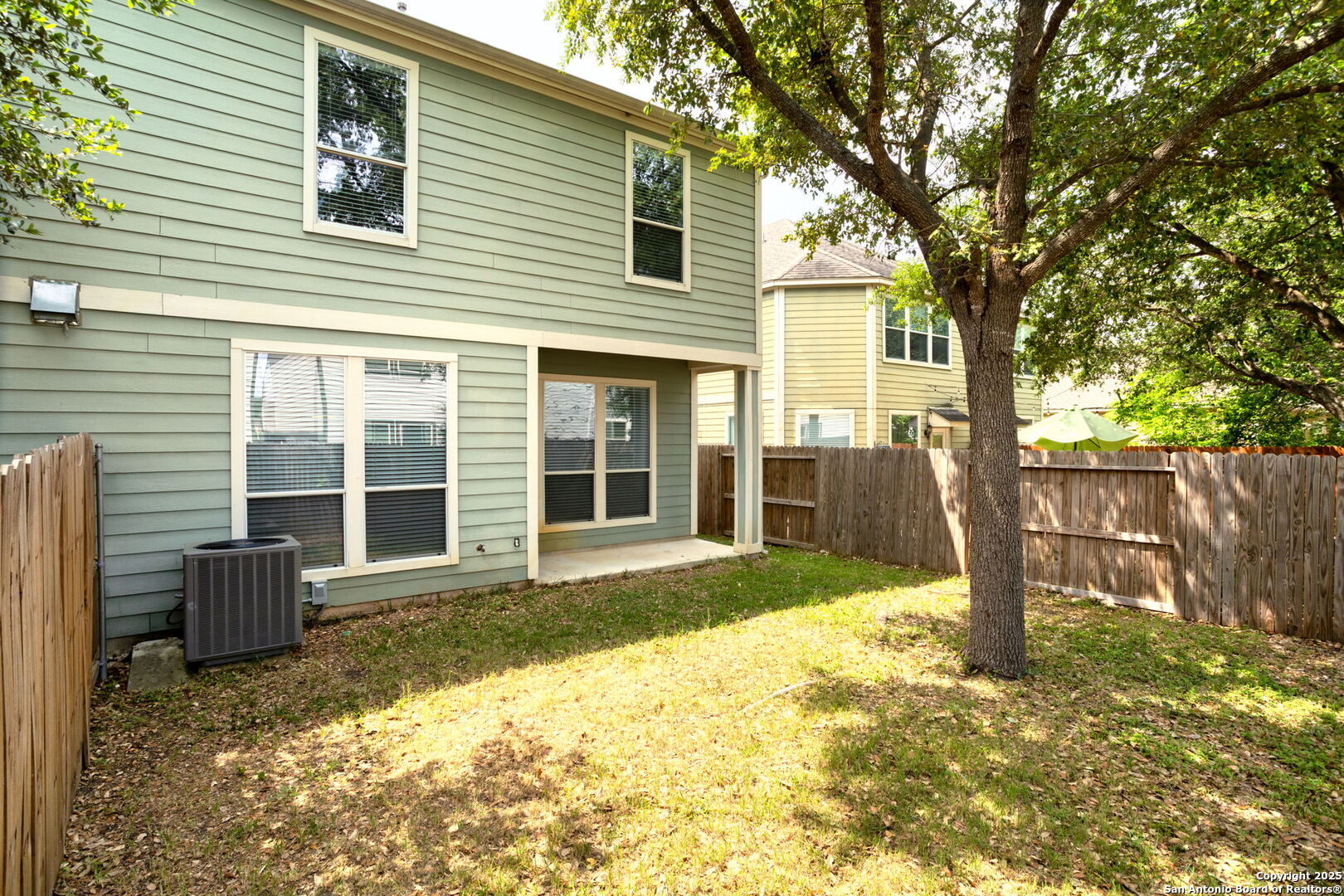 6737 Terra Rye San Antonio, TX 78240 - Photo 24 of 26 a front view of a house with a yard and garage