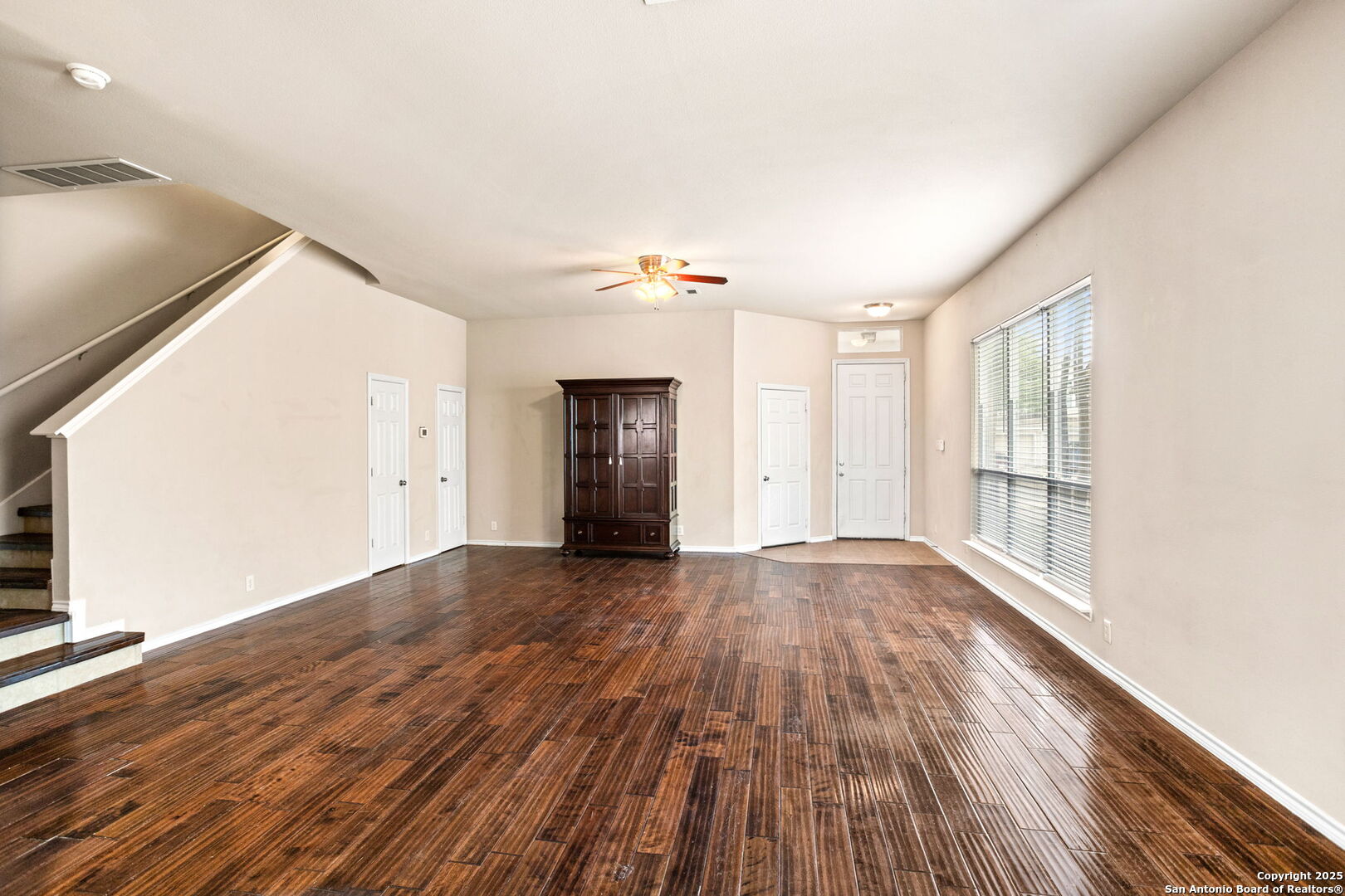 6737 Terra Rye San Antonio, TX 78240 - Photo 3 of 26 a view of an empty room with wooden floor and a window