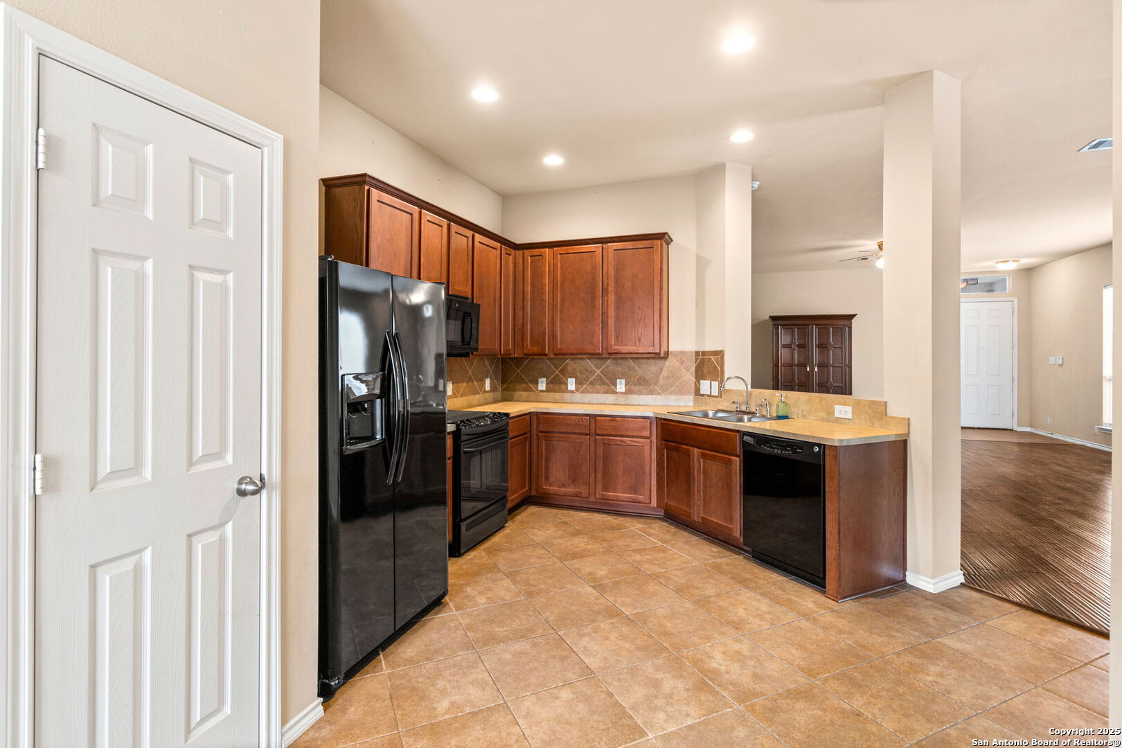 6737 Terra Rye San Antonio, TX 78240 - Photo 6 of 26 a kitchen with stainless steel appliances granite countertop a refrigerator stove and sink