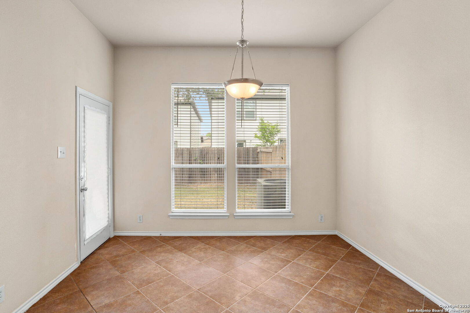 6737 Terra Rye San Antonio, TX 78240 - Photo 8 of 26 a view of an empty room with a window
