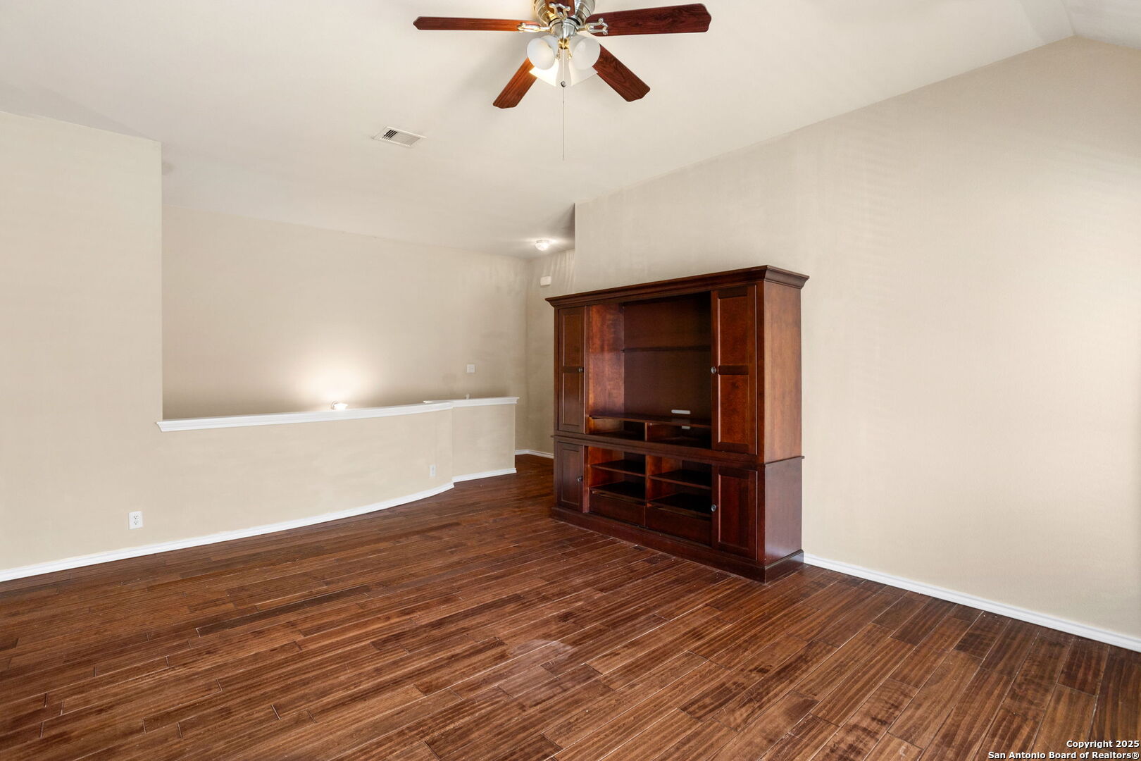 6737 Terra Rye San Antonio, TX 78240 - Photo 10 of 26 a view of empty room with wooden floor and fan