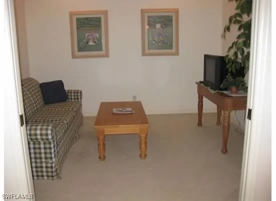 a room with furniture and a flat screen tv