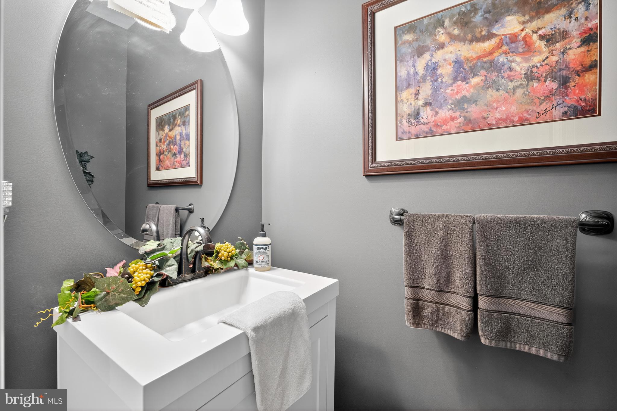 8768 Dunstable Loop Bristow, VA 20136 - Photo 12 of 47 a bathroom with a sink and a refrigerator