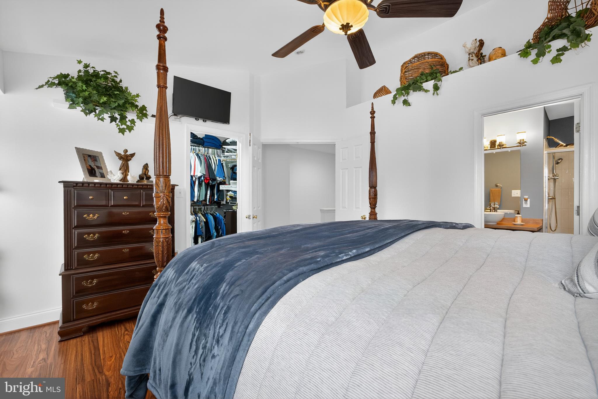 8768 Dunstable Loop Bristow, VA 20136 - Photo 14 of 47 a bedroom with a bed and a flat screen tv