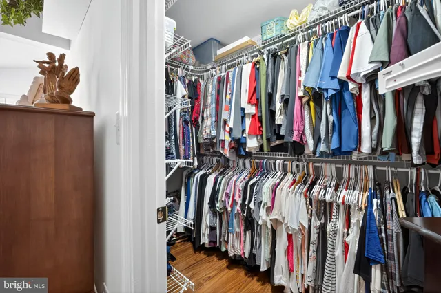 a bathroom with a sink and mirror with toilet