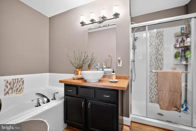 an aerial view of residential houses with outdoor space and swimming pool