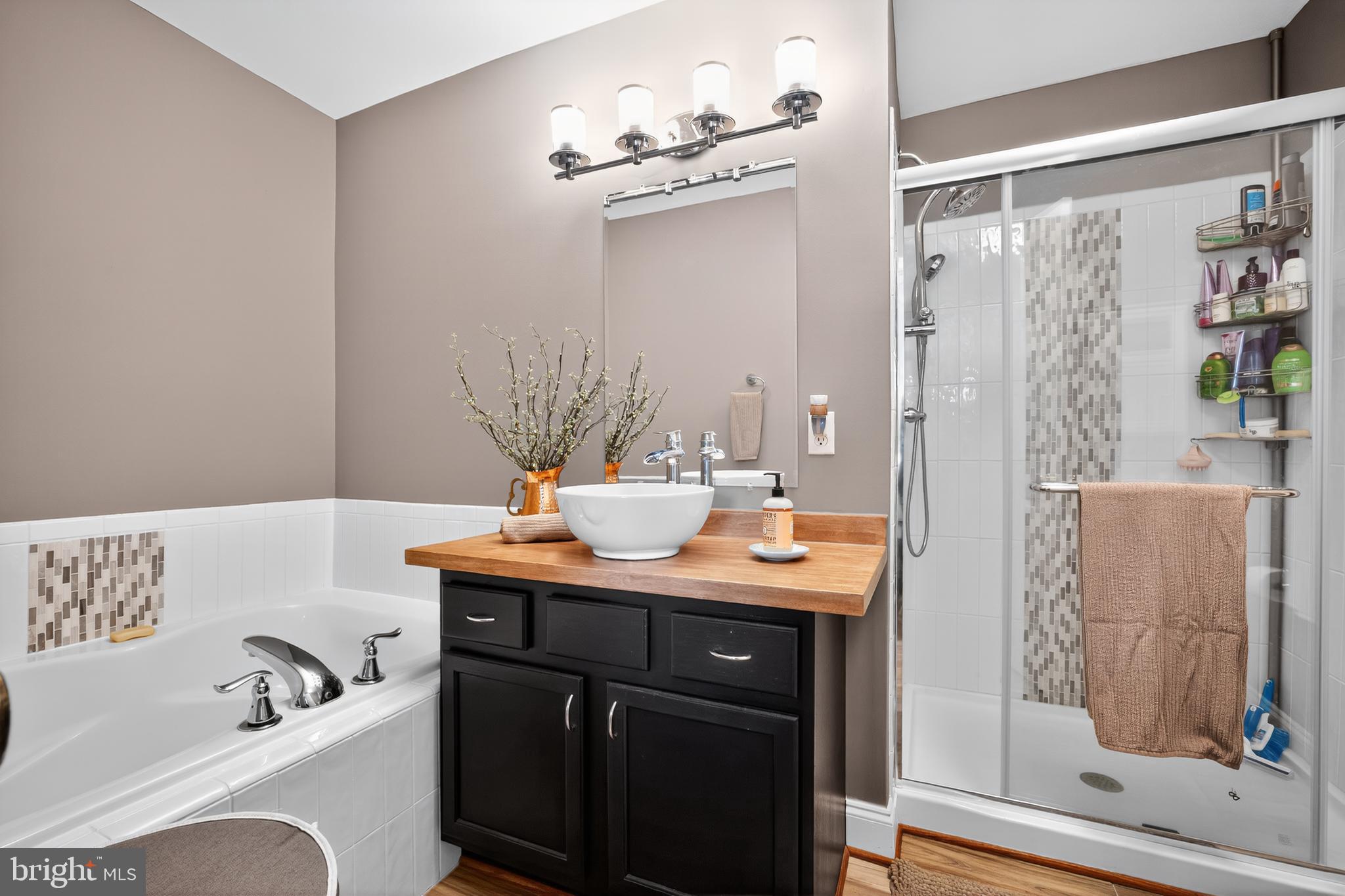 8768 Dunstable Loop Bristow, VA 20136 - Photo 17 of 47 a bath room with a sink and a mirror