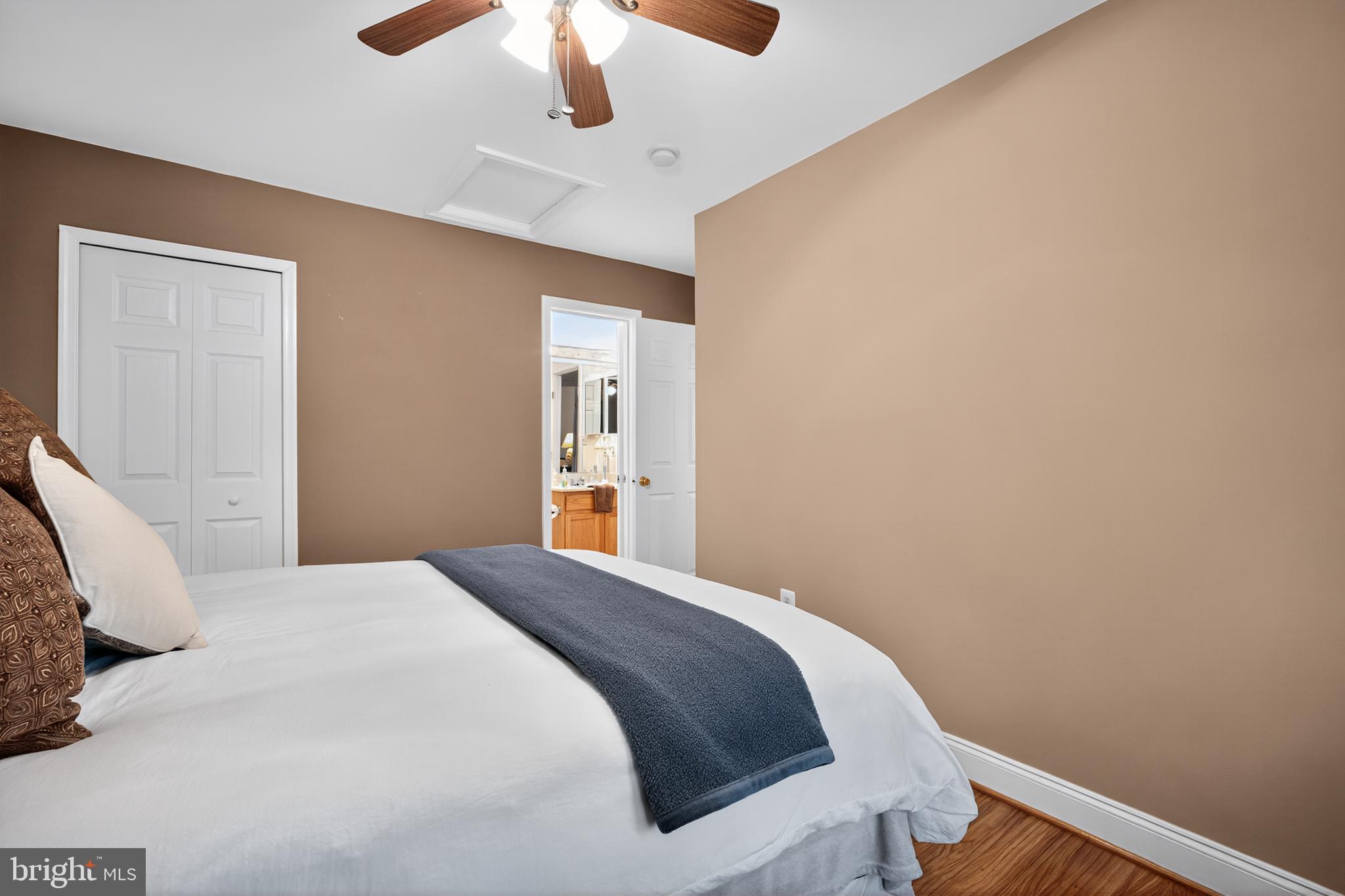 8768 Dunstable Loop Bristow, VA 20136 - Photo 18 of 47 a bedroom with a bed and a chandelier