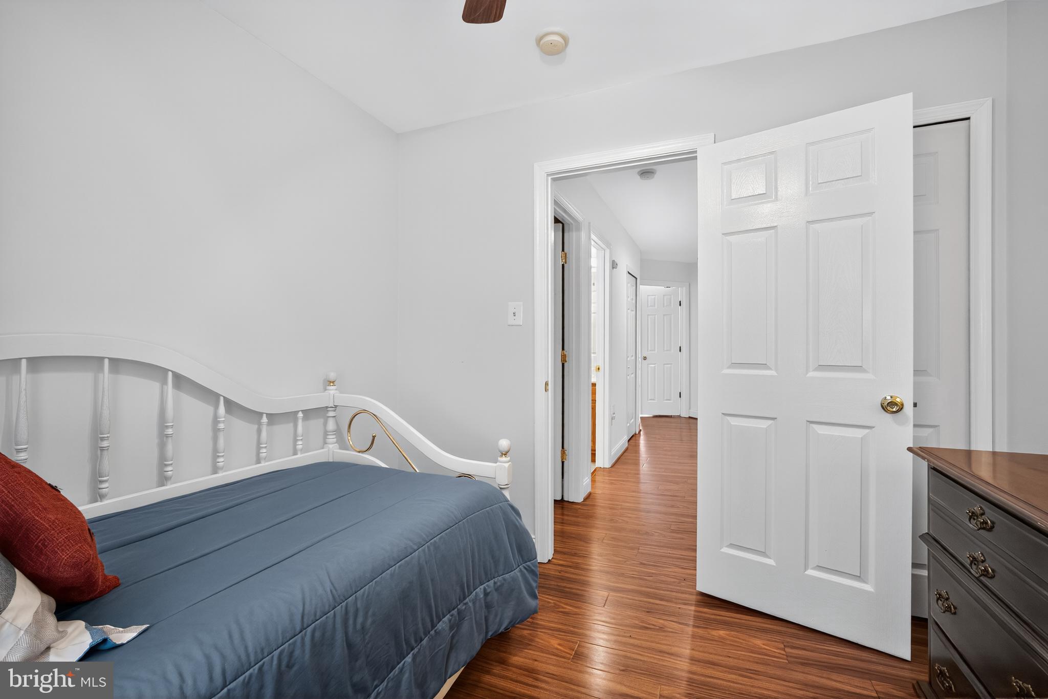 8768 Dunstable Loop Bristow, VA 20136 - Photo 21 of 47 a bedroom with a bed and wooden floor