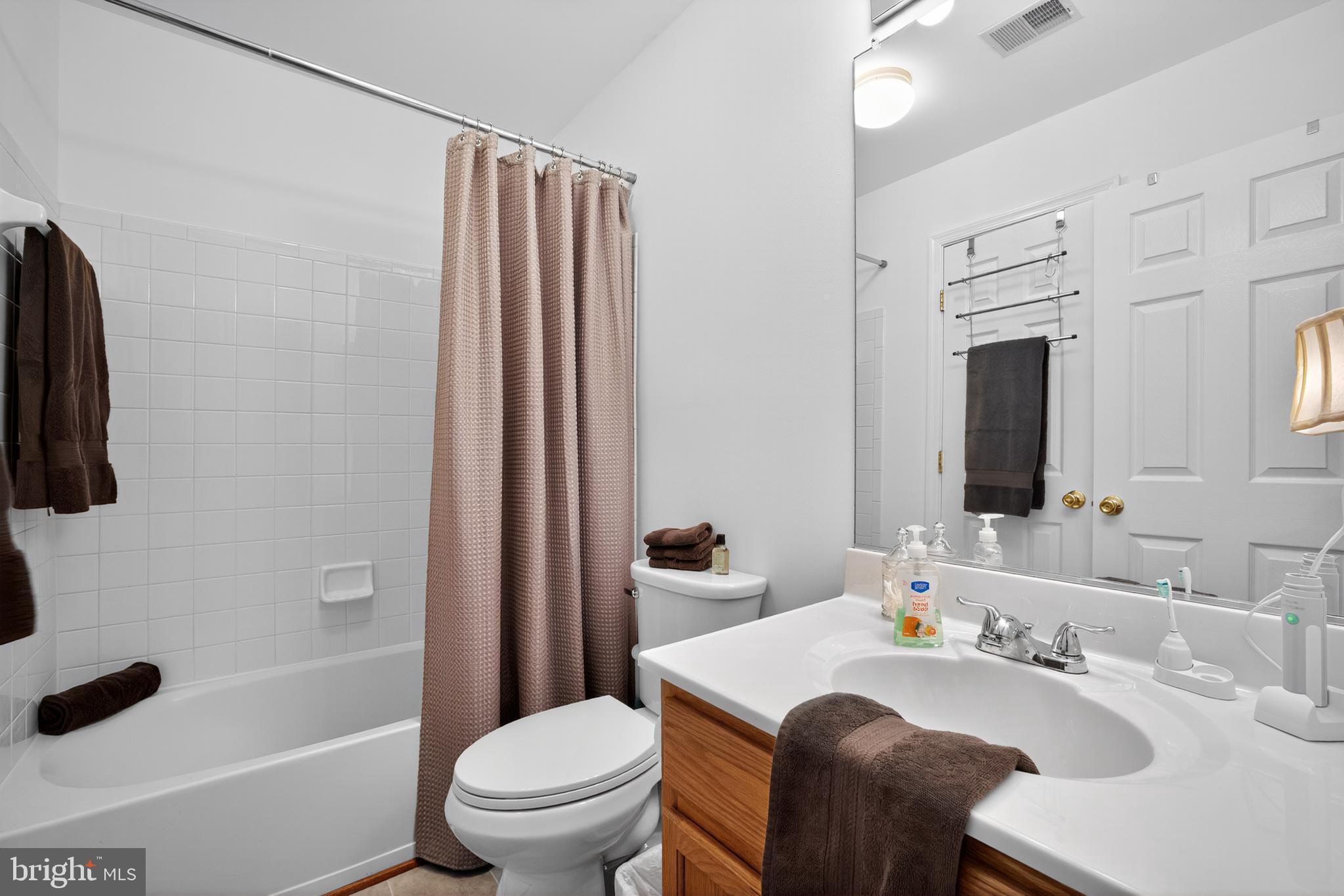 8768 Dunstable Loop Bristow, VA 20136 - Photo 22 of 47 a bathroom with a sink toilet and shower