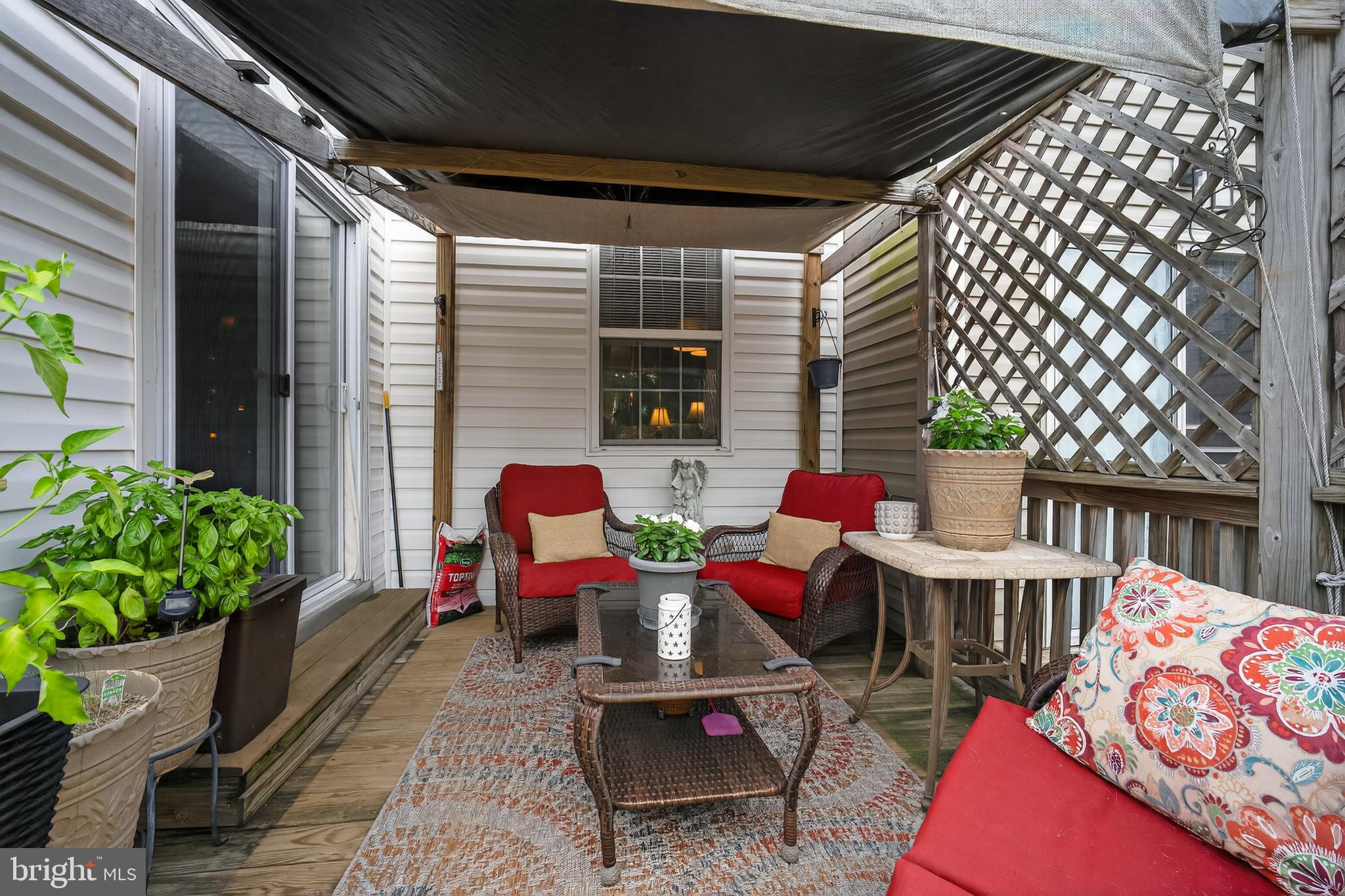 8768 Dunstable Loop Bristow, VA 20136 - Photo 31 of 47 a balcony with furniture and potted plants