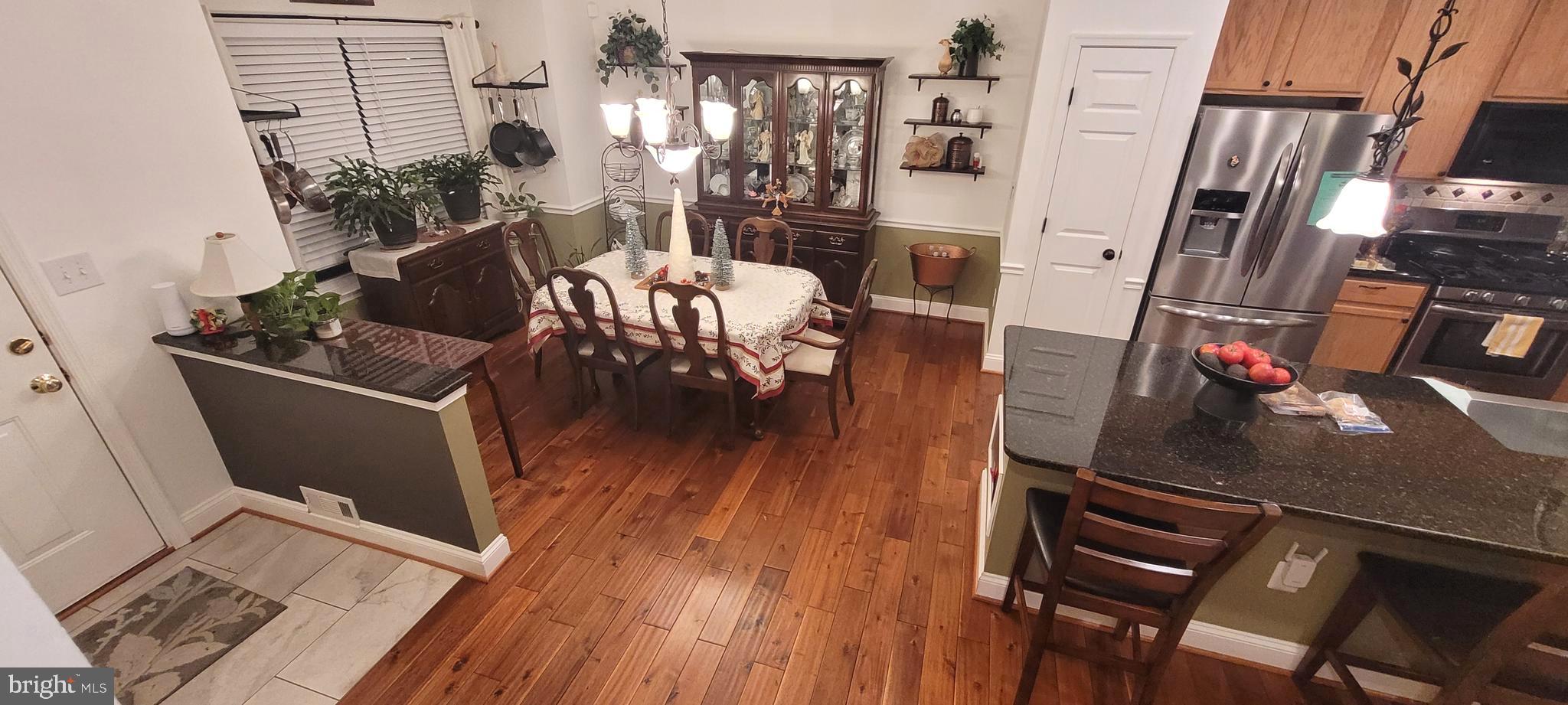 8768 Dunstable Loop Bristow, VA 20136 - Photo 4 of 47 a living room with furniture and wooden floor