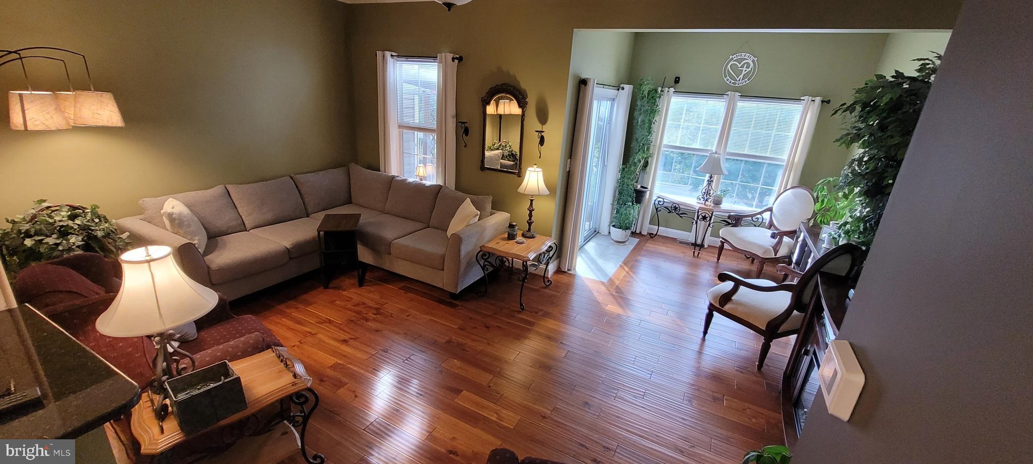 8768 Dunstable Loop Bristow, VA 20136 - Photo 10 of 47 a living room with furniture and wooden floor