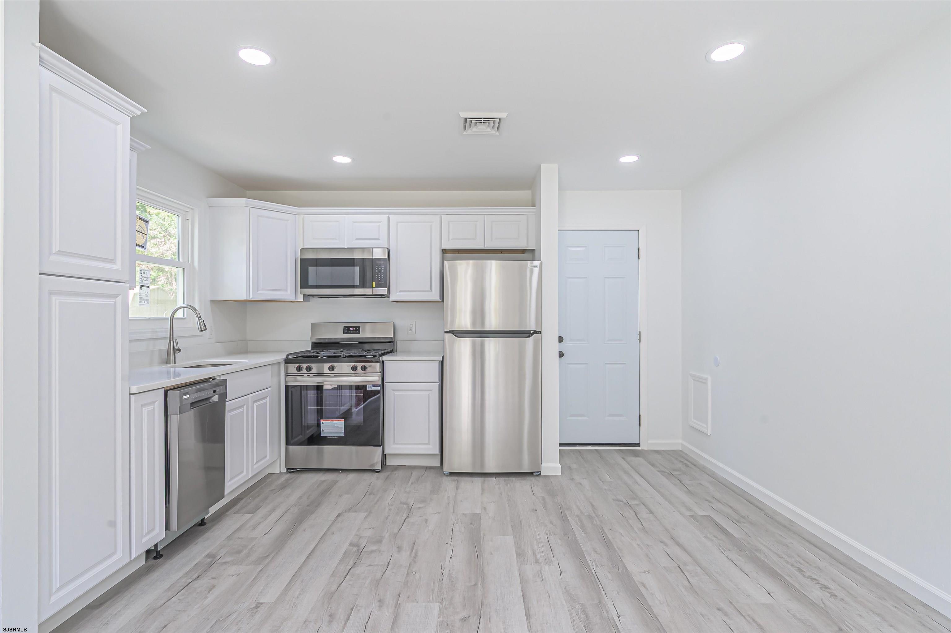 25 Robin Road Egg Harbor Township, NJ 08234 - Photo 3 of 24 a kitchen with cabinets and stainless steel appliances