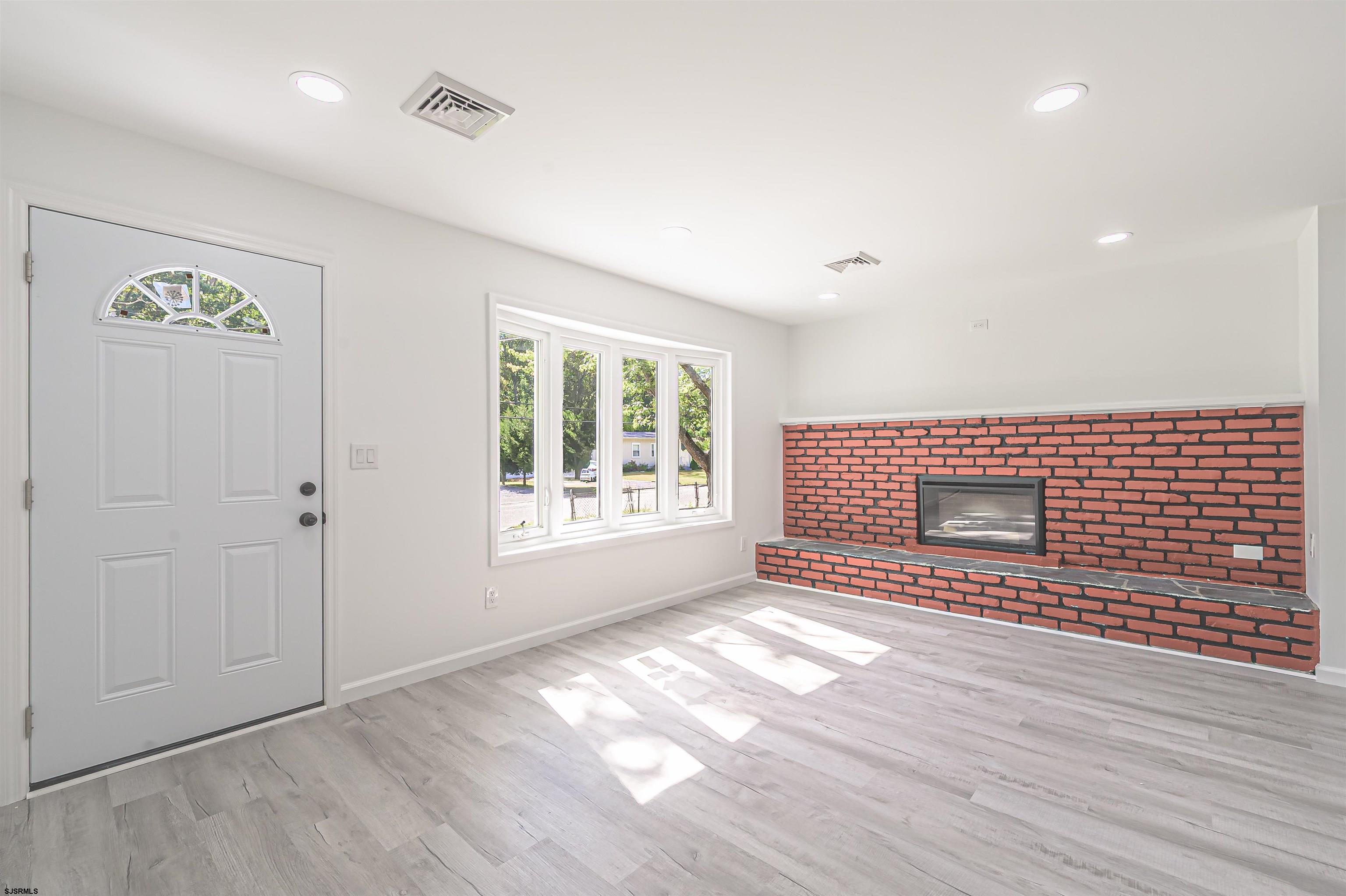 25 Robin Road Egg Harbor Township, NJ 08234 - Photo 7 of 24 a view of empty room with wooden floor and fan