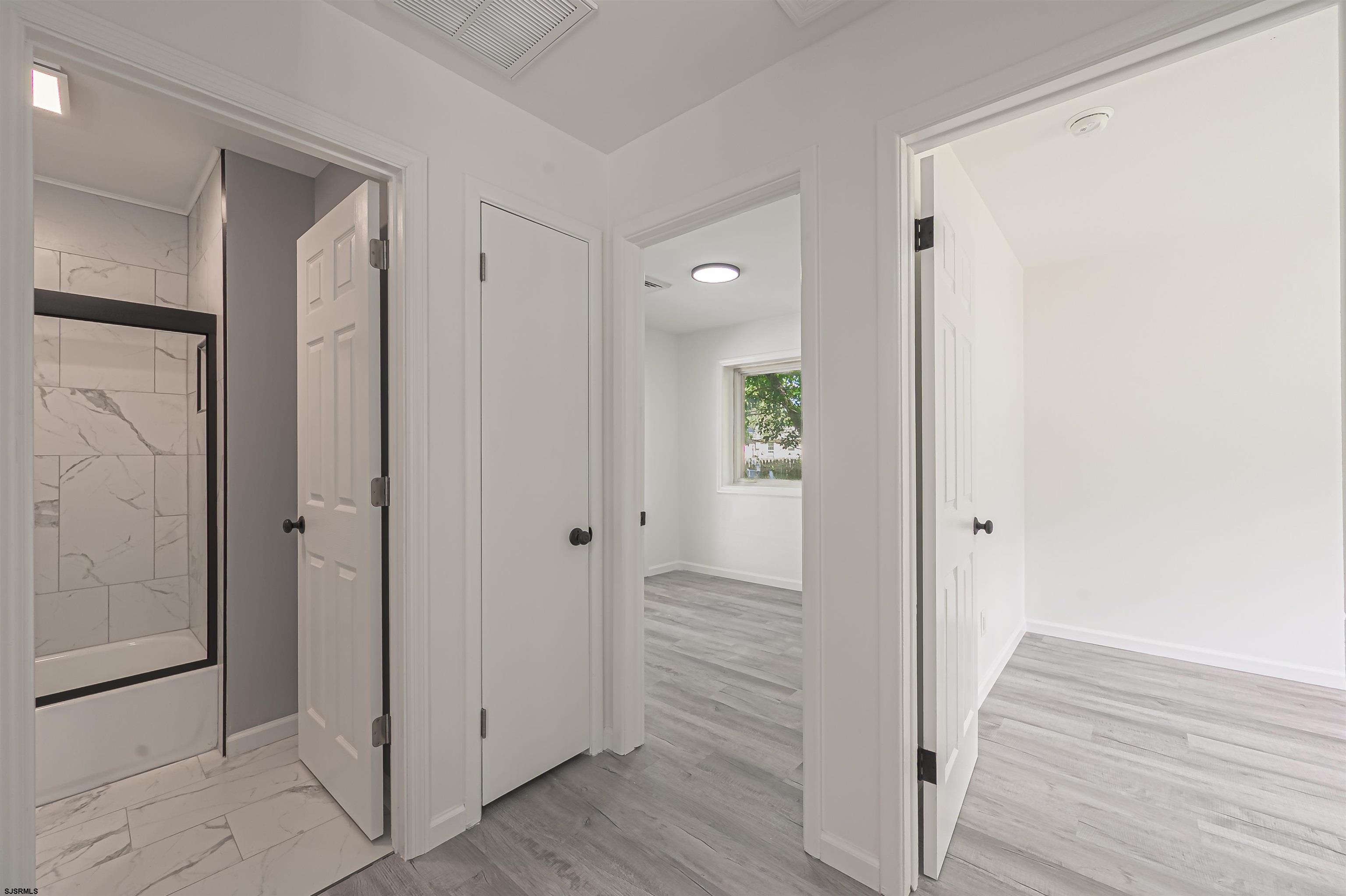 25 Robin Road Egg Harbor Township, NJ 08234 - Photo 9 of 24 a view of a hallway with wooden floor