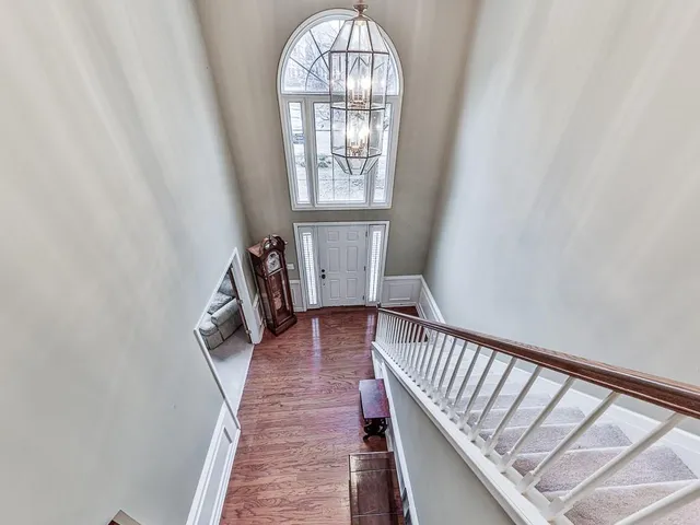 a view of an entryway with wooden floor
