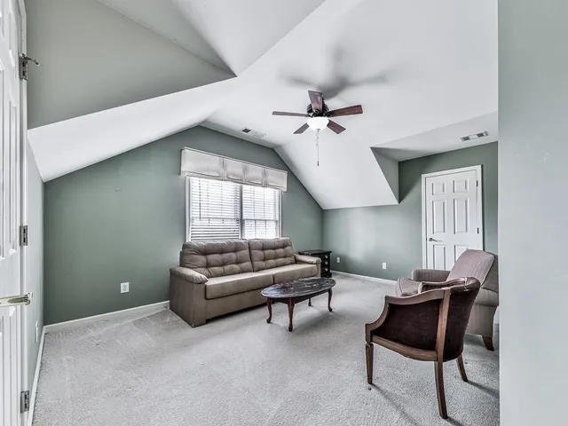 a living room with furniture and window
