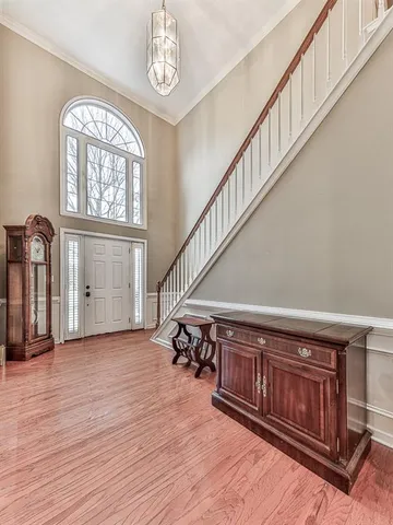 a view of an entryway with wooden floor