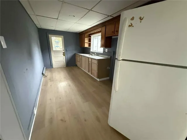 a kitchen with refrigerator a sink and dishwasher